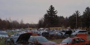 Wide shot of cars in salvage yard
